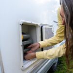 Woman,Taking,The,Black,Water,Tank,Of,A,Motorhome
