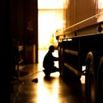 Silhouette,Blur,Automobile,Mechanic,Checking,Truck,In,The,Garage,,Selective